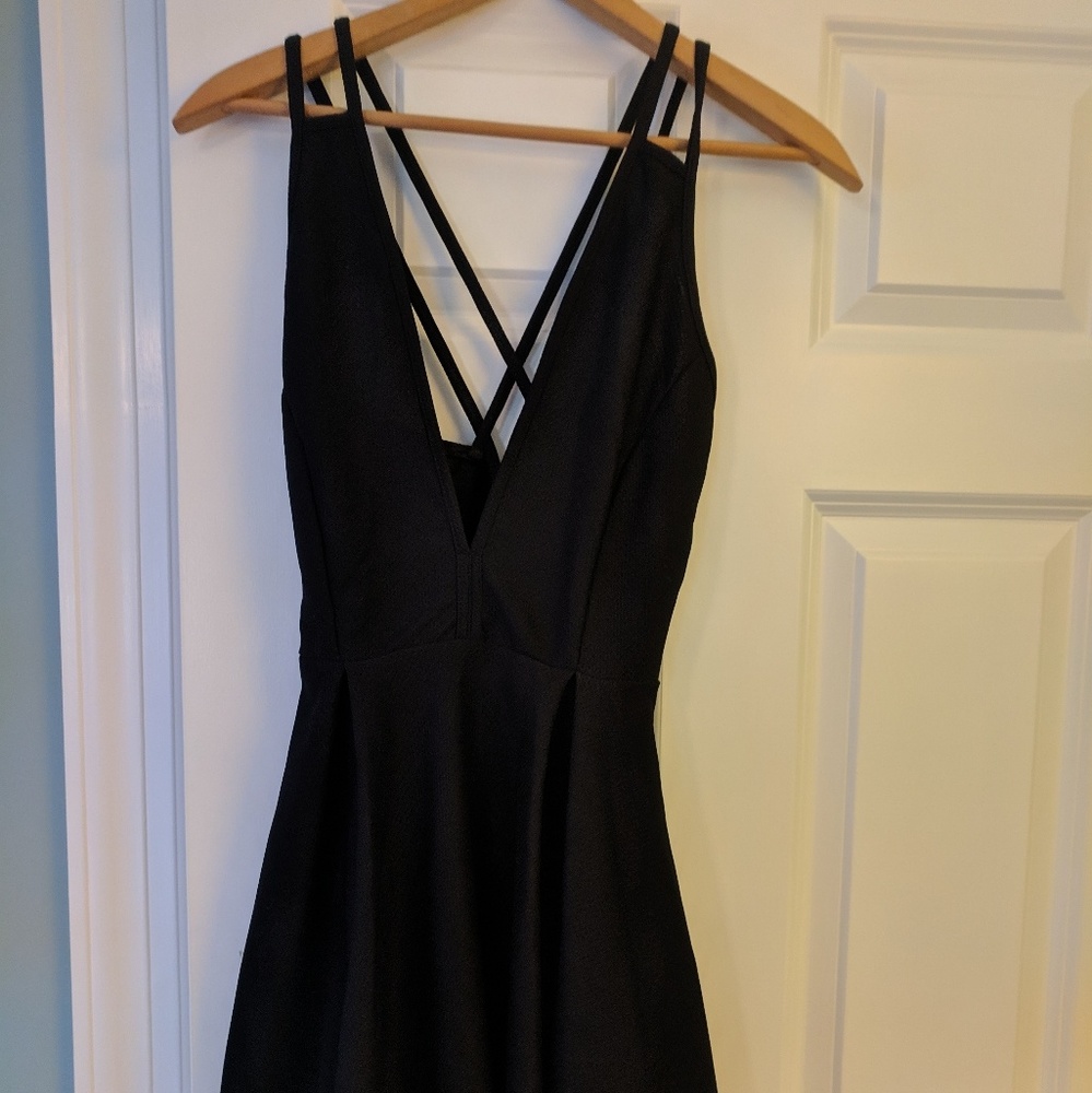Short, low cut black party dress